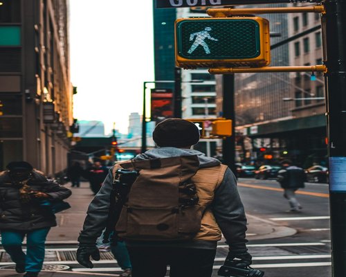Person walking along a quiet city street